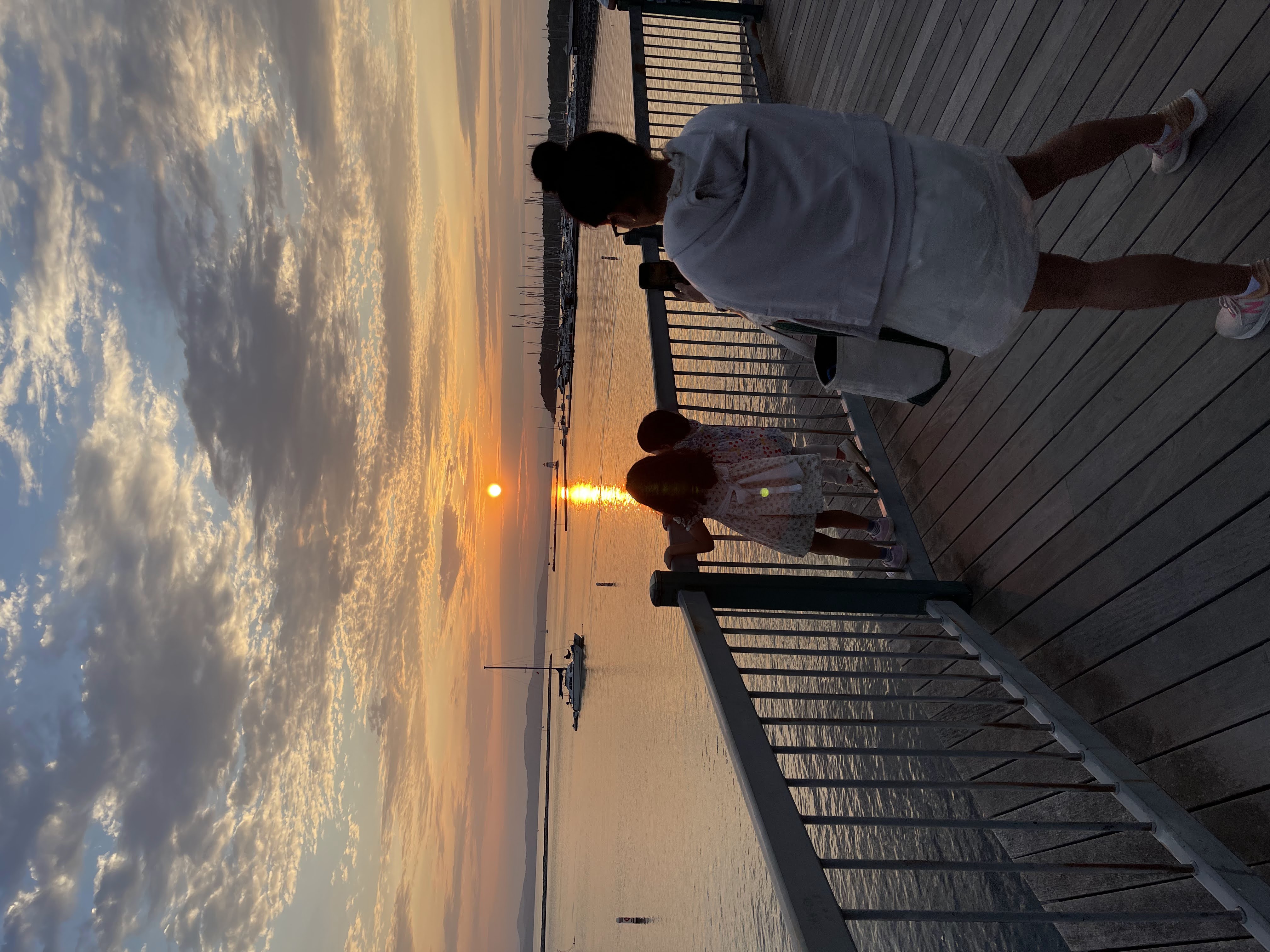 Rajiv Shrestha’s family watching the sunset by the water